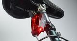 Zadné LED svetlo na bicykel s laserom